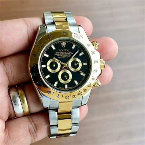 silver and gold watch rolex